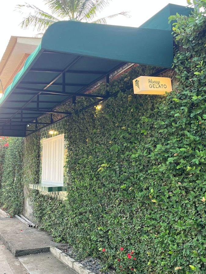 Honey Gelato storefront sign surrounded by tropical greenery in Kuta South Lombok